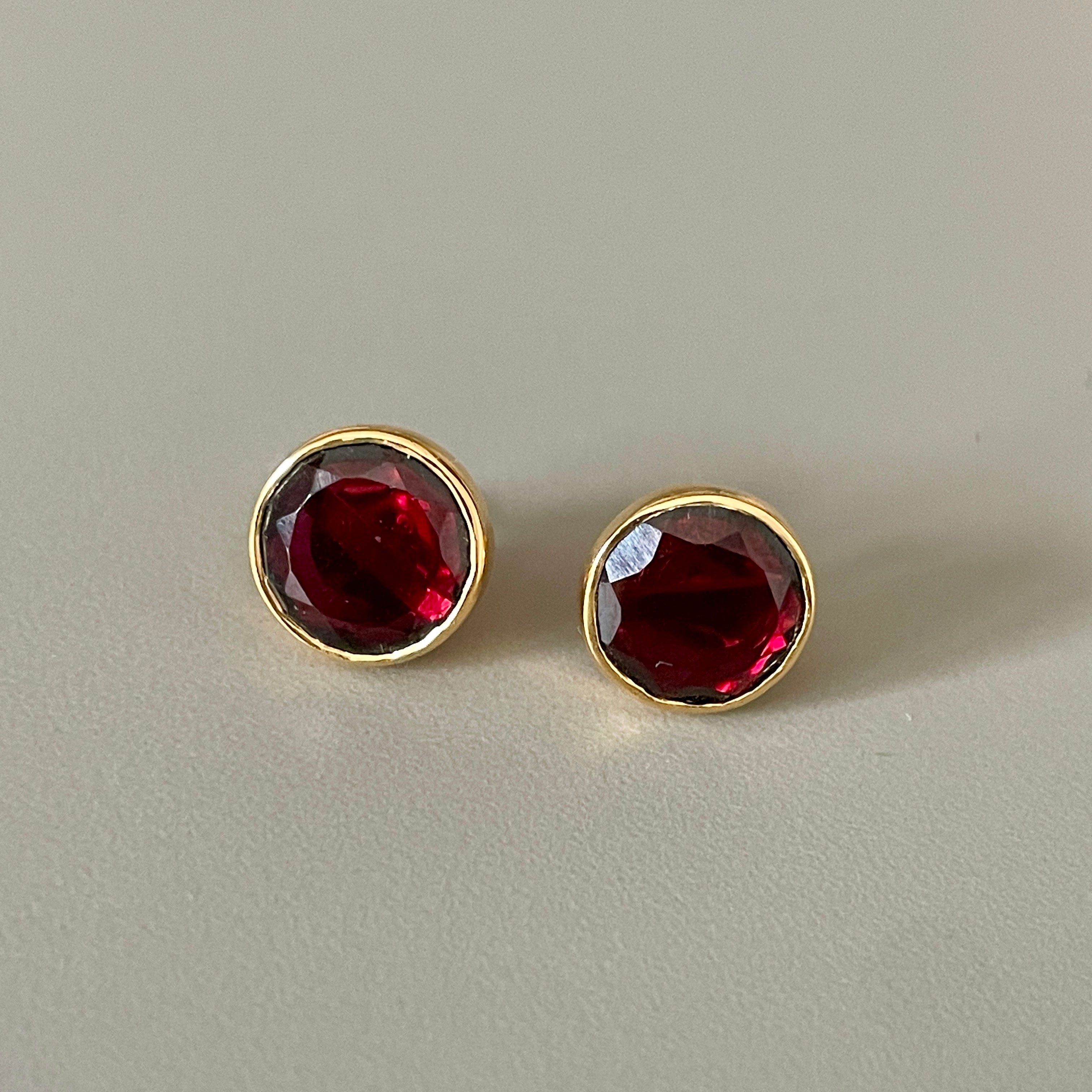 Garnet Studs in Gold Plated Sterling Silver with a Round Faceted Gemstone - Milina London