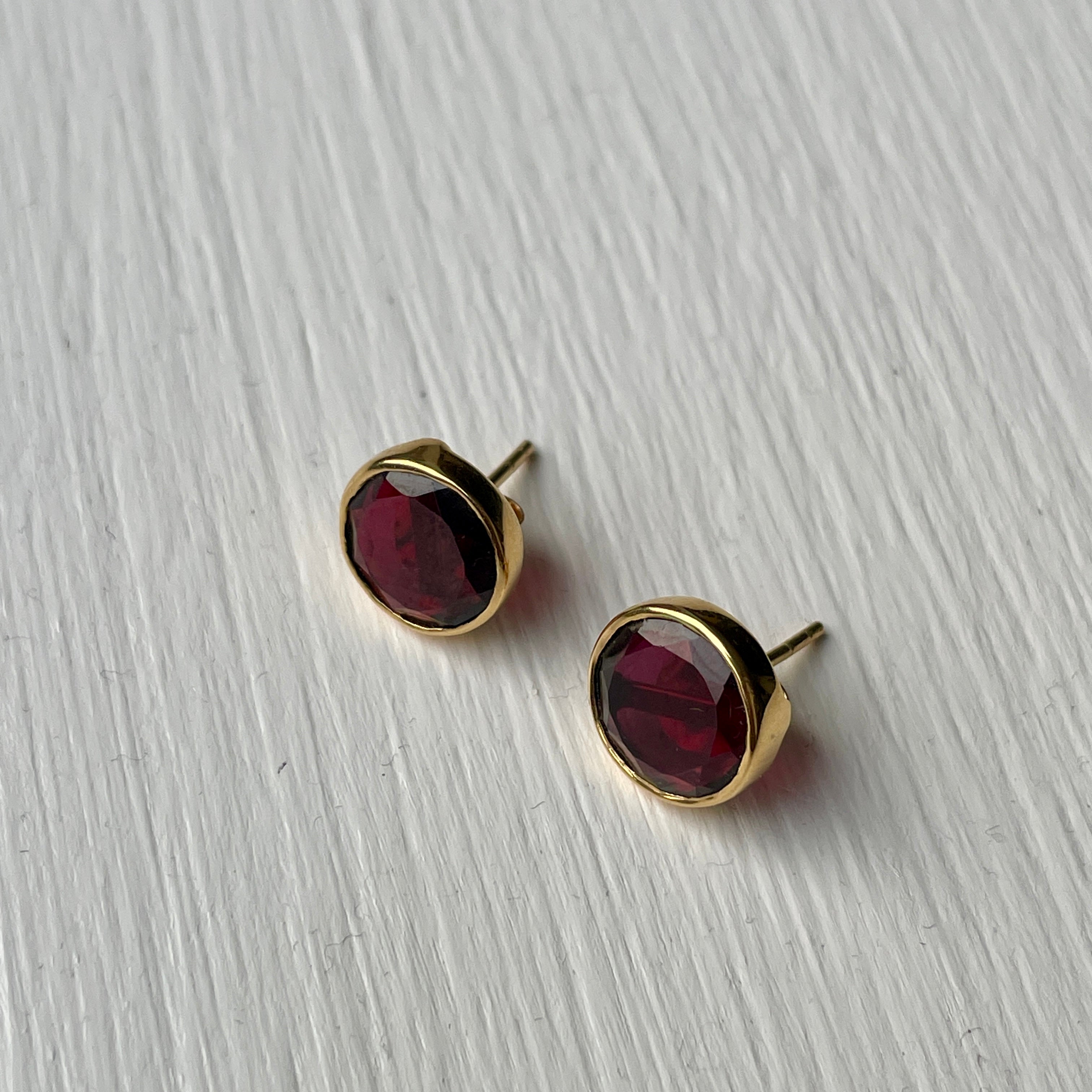 Garnet Studs in Gold Plated Sterling Silver with a Round Faceted Gemstone