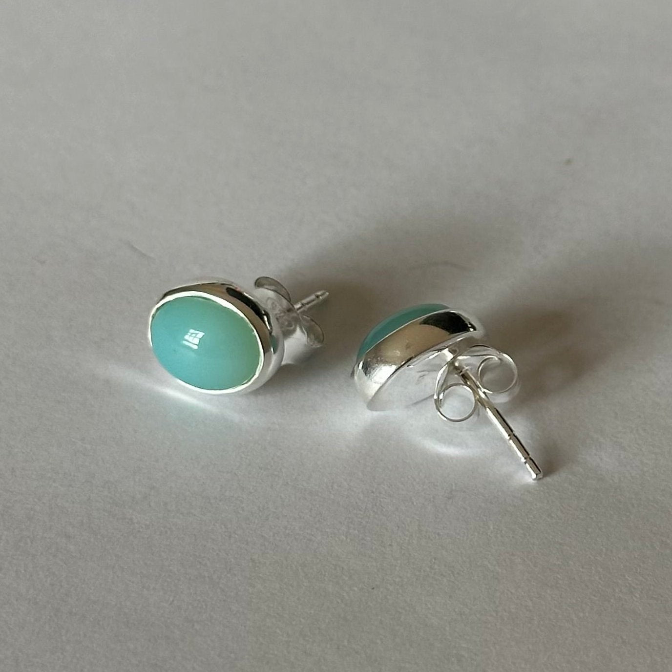 Sterling Silver Oval Stud Earrings with Cabochon Cut Aqua Chalcedony Gemstone - Milina London