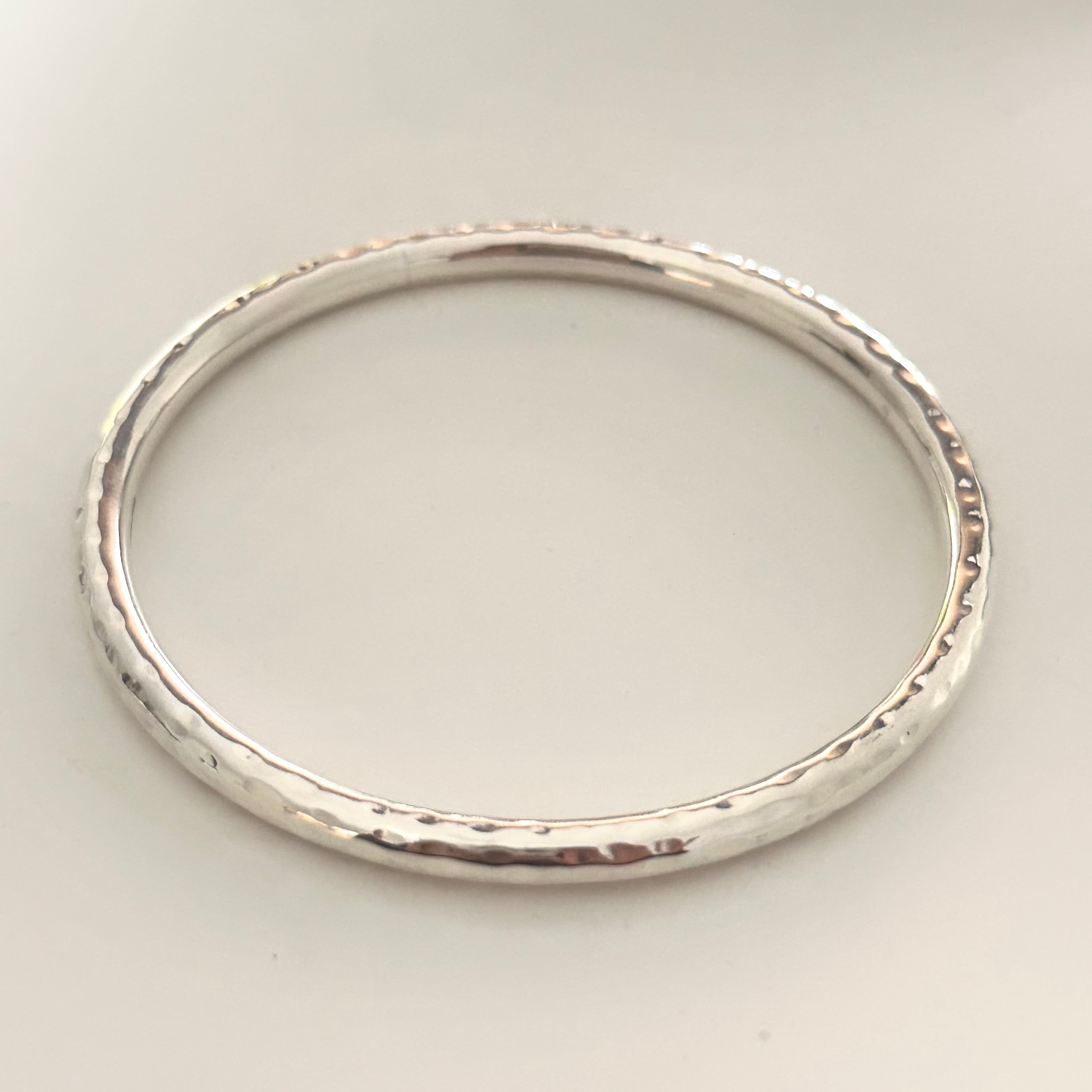 Sterling Silver Narrow Hammered Bangle - Milina London