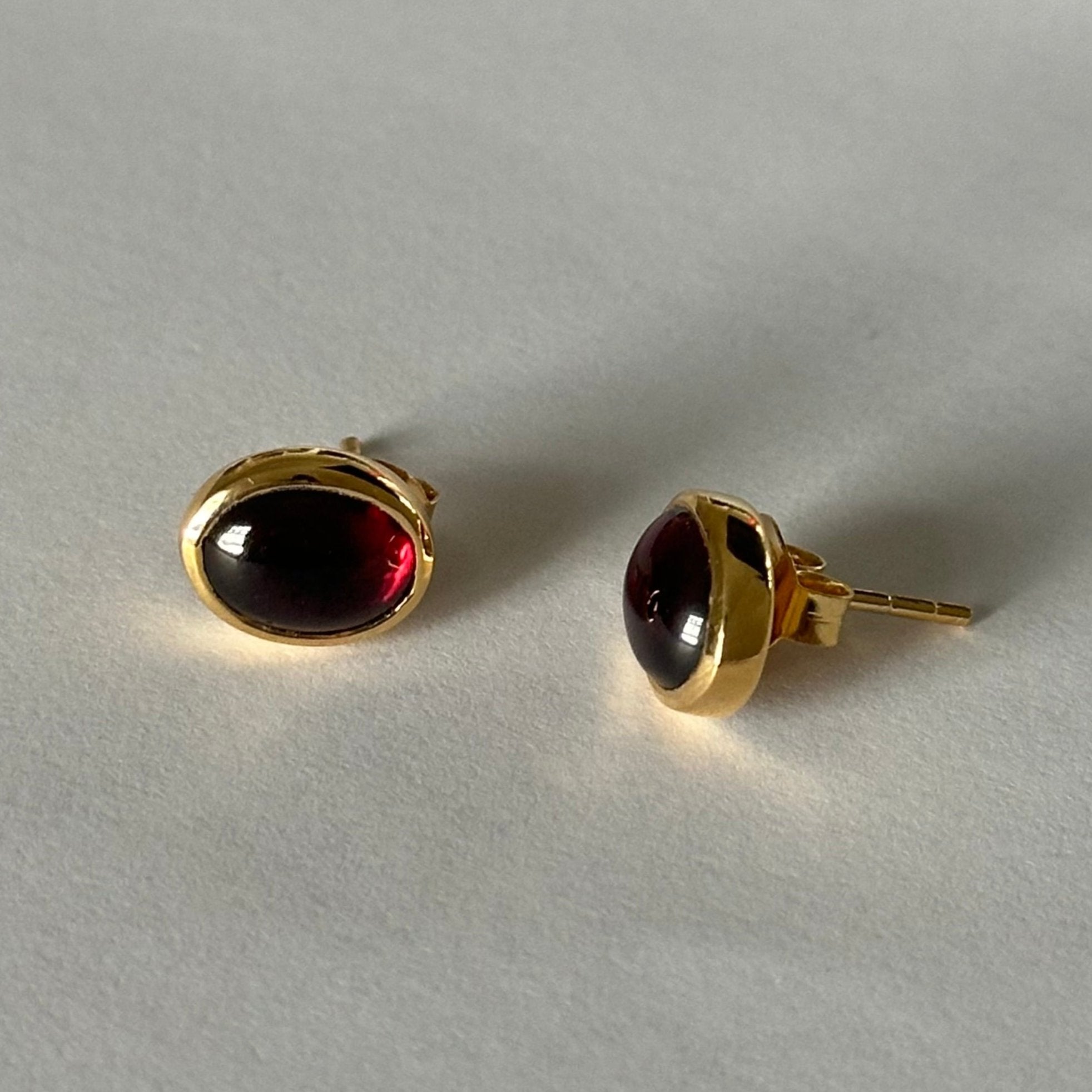 Gold Plated Sterling Silver Oval Stud Earrings with Cabochon Cut Garnet Gemstone - Milina London